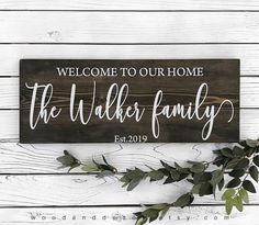 a wooden sign that says welcome to our home the walker family