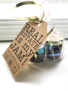 an image of some food wrapped in cellophane and ribbon for sale on the window sill