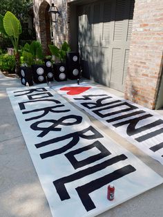 two large street signs sitting on the side of a road