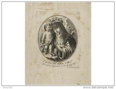 an old book with a drawing of the virgin mary and child in it's lap