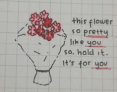 a piece of paper with a drawing of flowers in the center and words written on it