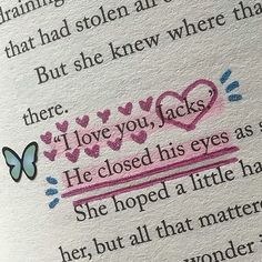 an open book with pink and blue writing on the pages, which reads i love you