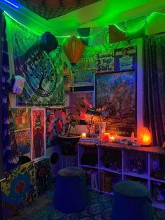 a room filled with lots of colorful lights and posters on the wall next to bookshelves