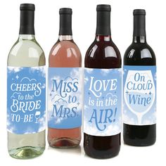 three wine bottles with labels on them that say cheers to the bride, love is in the air