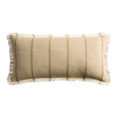 a beige pillow with fringes on the front and back, against a white background