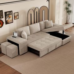 a living room with a sectional couch and coffee table on the floor in front of it