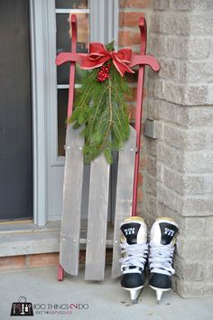 a pair of black and white sneakers sitting on top of a wooden sled next to a door