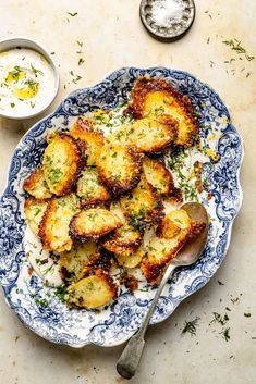 Easy, crispy parmesan roasted potatoes with fresh lemon and herbs. Serve these savory parmesan potatoes with an incredible roasted garlic feta dip alongside your favorite mains and proteins! The perfect side dish for any dinner table. Garlic Feta Dip, Tahini Sauce Recipe, Crispy Parmesan Potatoes, Parmesan Roasted Potatoes, Roasted Potato Recipes, Weeknight Recipes, Ambitious Kitchen, Seasonal Cooking, Parmesan Potatoes