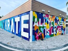 a colorful building with the words all you need is love painted on it