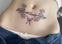 a woman with a tattoo on her stomach