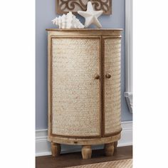 a wicker cabinet with a starfish on top