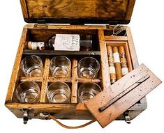 an open wooden box with many glasses in it