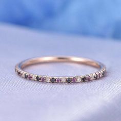 1ct Simulated Purple Amethyst Wedding Band Ring Full Eternity Rose Gold Plated Note: This ring is made to order. Kindly confirm your ring size within 24 hours of purchase for speedy process of manufacturing. Box shown in image may differ as per availability. Ct. wt. mentioned is approx weight and may vary ( high/low) post manufacturing. Shipping Policy: 1. Manufacturing usually takes 10-15 business days after receiving clear payment and ring size confirmation ( Business days excludes Saturdays / Sundays and Public Holidays) as the product is Made-To-Order. 3. Delivery time will be according to the shipping services but it mostly takes around 5-15 working days (which may extend during peak season time). 3. Kindly provide complete address and contact number for hassle free shipping. Contact Eye Jewels, Rough Stone Jewelry, Amethyst Wedding Band, Mother's Ring, Pink Morganite Engagement Ring, Amethyst Wedding, Morganite Engagement Ring, Custom Ring, Colored Gems