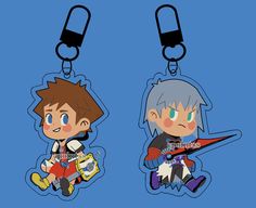 two key chains with cartoon characters on them