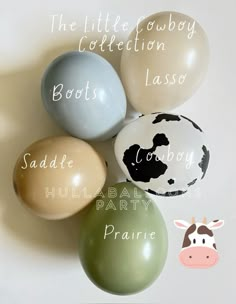 several balloons with names on them are arranged next to a cow and giraffe