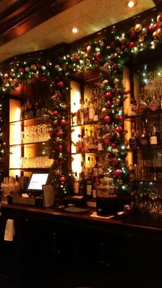 a bar decorated with christmas decorations and lights