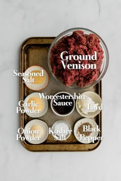 the ingredients for ground meat on a tray