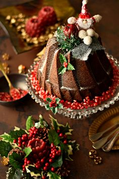 a christmas cake on a table with decorations