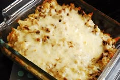 a casserole dish with cheese and meat in it