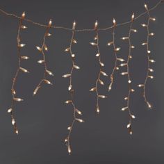 Create a gorgeous display in your home for the holidays or any other occasion with the 300-Count High Density Icicle Lights with White Wire from Wondershop™. These icicle lights are designed with 300 bulbs that connect end-to-end to look great along roof awnings, peaks, windows or any other space. The clear lights help create a glowing space with their constant lighting effect and light up with one setting. Wondershop™: Welcome to the Wondershop. Christmas Icicle Lights, Icicle Lights Outdoor, Cherry Blossom Candle, Led Icicle Lights, Icicle Christmas Lights, Christmas Decorations Apartment, Hanging Christmas Lights, Globe String Lights, Christmas Apartment