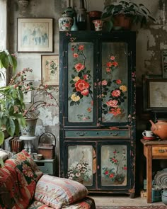 an old cabinet with flowers painted on it