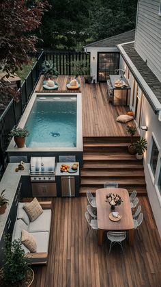 an aerial view of a backyard with a pool and hot tub, patio furniture and outdoor dining area