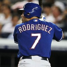 a baseball player holding a bat during a game