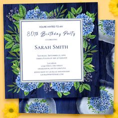 a blue and white birthday party with flowers on it