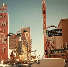 an old photo of the california club and gambling signs in las vegas, nevada usa