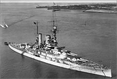 an old photo of a battleship in the water