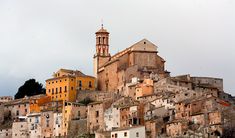 an old town with many buildings on the hillside