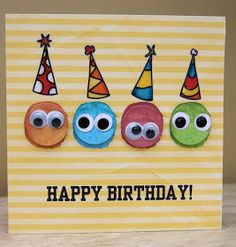 a happy birthday card with three little monsters wearing party hats and the words happy birthday written on it