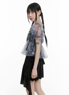 Product Detail Elevate your style with our KPOP-inspired women's fashion collection. Perfect for street and romantic looks, this crop top features shirring, frill, and see-through details. Ideal for festival occasions with a square neck and short sleeves. Style : Street, Romantic Occasion : Festival Detail : Shirring, Frill, See-through Material : Polyester, Rayon Sleeve : Short sleeve Neck : Square neck Length : Crop Fit : Normal fit Polyester 95 Rayon 5 Color : Blue Model Size Model is wearing Summer Evening Organza Blouse, Summer Party Organza Top, Spring Party Chiffon Tops, Sheer Puff Sleeve Top For Party, Feminine Organza Tops For Spring, Spring Ruffled Short Sleeve Crop Top, Spring Party Crop Top With Puff Sleeves, Feminine Ruffled Short Sleeve Crop Top, Spring Party Blouse With Flowy Fit