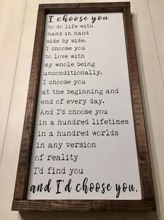 a wooden framed sign with the words i'd choose you to be loved by someone else