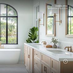 a bath room with a tub a sink and two mirrors on the side of it