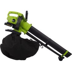 a green and black blow dryer sitting on top of a bag