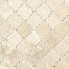 a white and beige tile pattern with wavy lines on the floor, as well as an oval