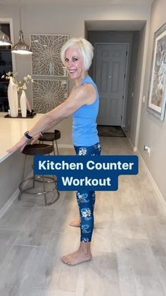 a woman standing in a kitchen with the words kitchen counter workout on her leggings