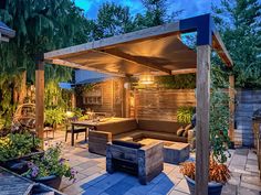 an outdoor living area is lit up at night