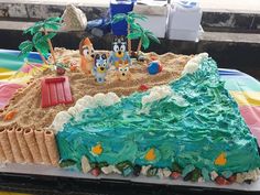 a cake that is shaped like a beach scene