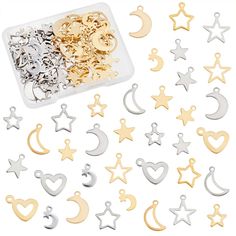 various shapes and sizes of metal charms in a plastic container with gold, silver, and white stars