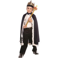 a little boy dressed in a king costume and holding a stick with both hands on his hip