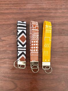 These super colorful keychains/key fob wristlets are perfect for any outfit and occasion. They are perfect for holding keys or other things and all have cute western patterned fabric to them. These keychain wristlets can make the perfect gift for yourself or others. The keychain hardware is silver and the keychain is hand sewn.  *Please note: since these keychain are handmade and not manufactured, there is some variation in the pattern of each keychain (see pictured to see variation) although it is not a dramatic difference, just keep this in mind :) * Please do not hesitate to message me with any questions! :) While I do not accept returns or exchanges, if your jewelry arrives broken or breaks soon after purchasing, I am willing to offer a refund or a replacement. I do require photographi Tooled Leather Wristlet Keychain, Cute Western Keychains, Western Keychains, Western Wrist Keychain, Western Leather Keychain, Western Wristlet Keychain, Keychain Wristlets, Key Fob Wristlet, Key Fobs Wristlet