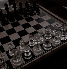 a chess board with glass pieces on it