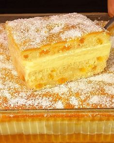 a person cutting into a cake with a knife