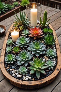 succulents and candles are arranged in a wooden tray on a table outside