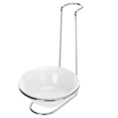 a white bowl on a metal holder