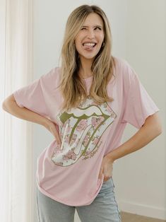 Our 100% Preshrunk Cotton thrifted tees are meaningfully distressed and officially licensed. Each piece is one of a kind, and colors/distressing may vary from shirt to shirt. Pairs well with vintage denim and your favorite kicks.The details:- 100% Preshrunk Cotton- Unisex Fit- Meaningfully Distressed, each piece unique- Colors + Distressing may vary- Officially Licensed Spring Distressed Graphic Tee T-shirt, Spring Distressed Relaxed Fit T-shirt, Casual Pink T-shirt For Fan Merchandise, Grunge Cotton Tops For Spring, Spring Grunge Cotton Tops, Spring Cotton Grunge Tops, Pink Distressed Graphic Tee, Grunge Screen Print Tops For Spring, Casual Distressed Tri-blend T-shirt