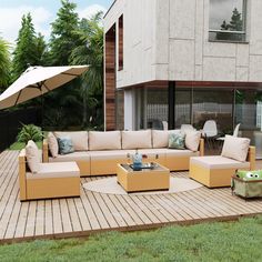 an outdoor living area with patio furniture and umbrella