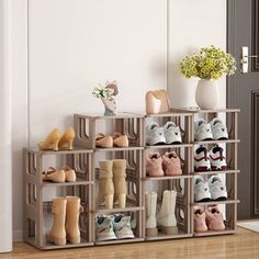 there are many pairs of shoes on the shelf in this room, and one is empty